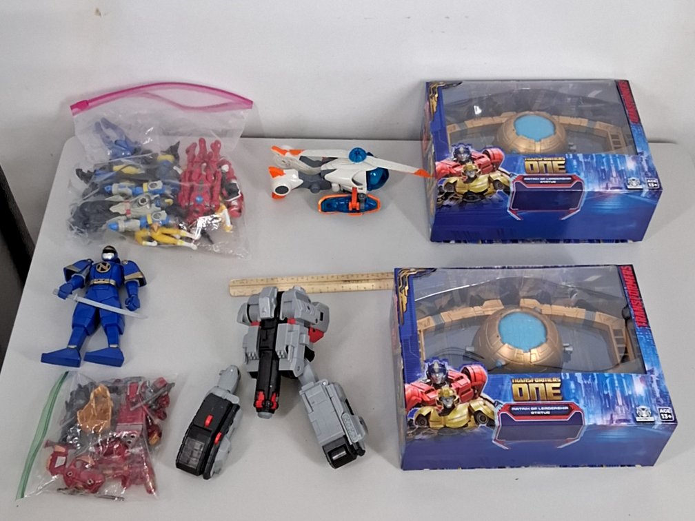 lot of action figures incl Transformers in boxes,