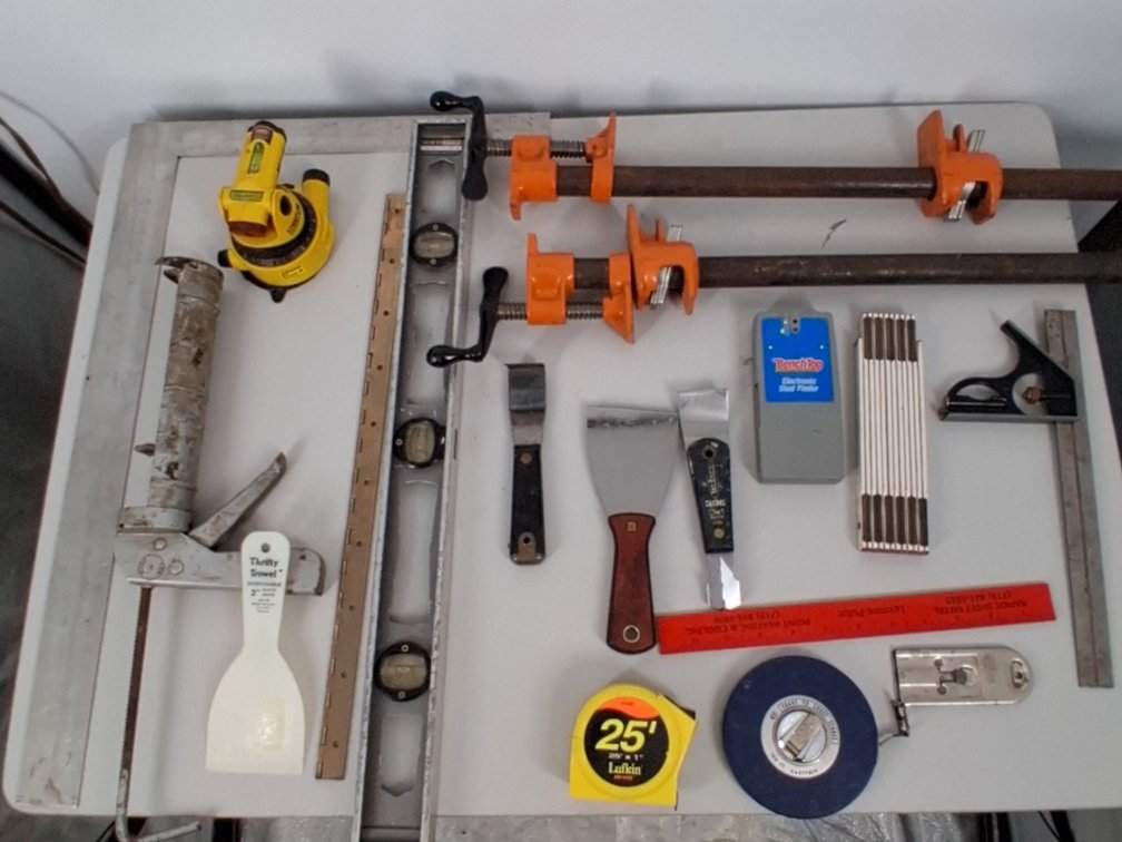 lot of 2 pipe clamps, stud finder, tape measure