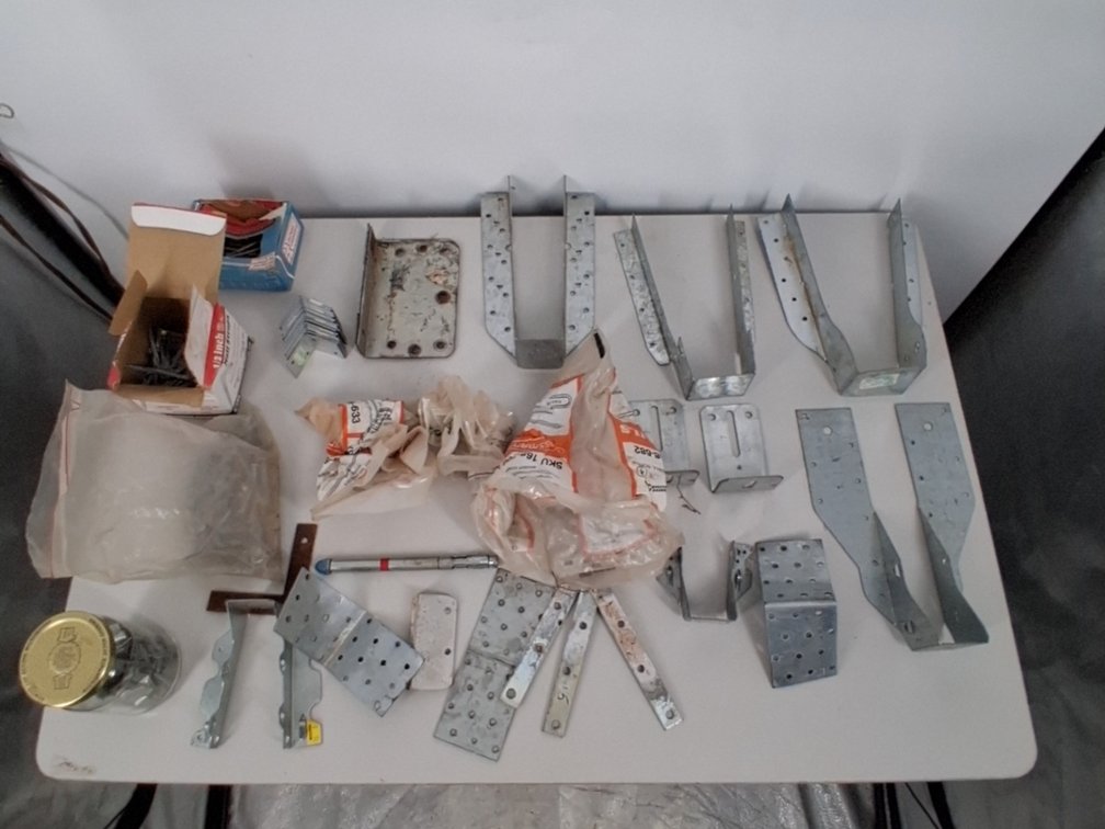 lot of joist hangers, nail straps,