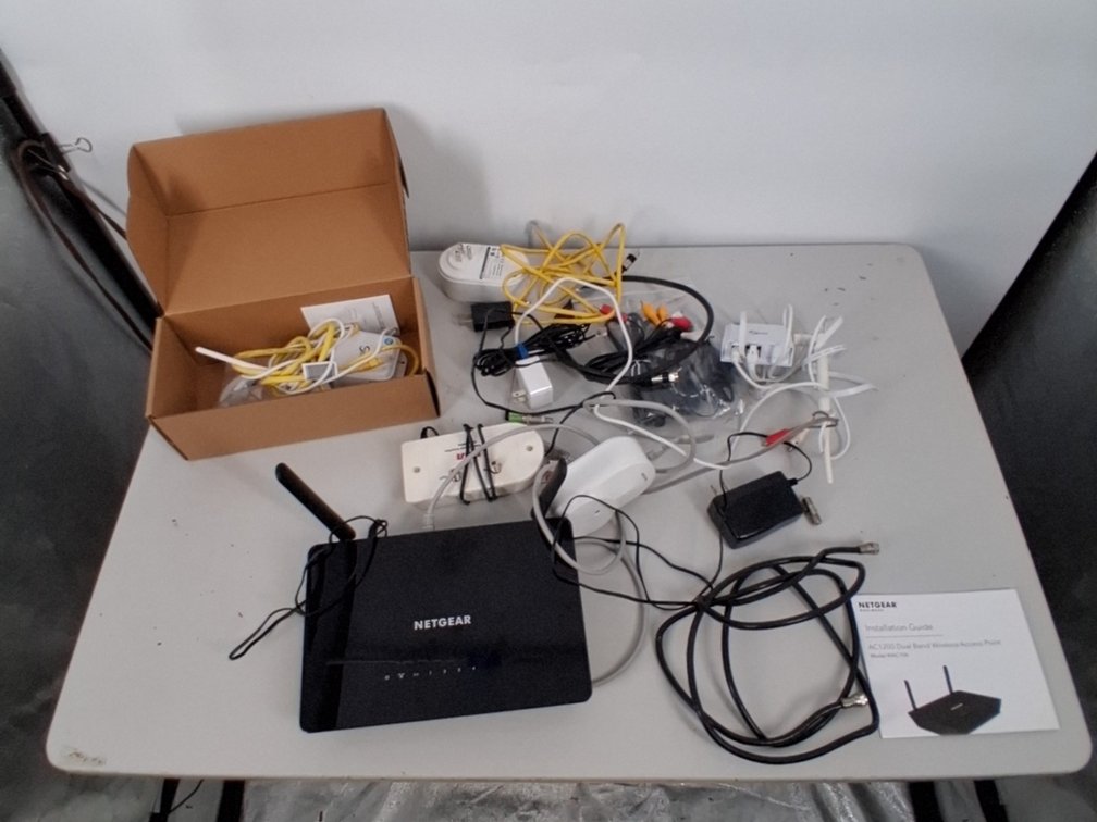 lot of Netgear Wi-Fi router, internet cables