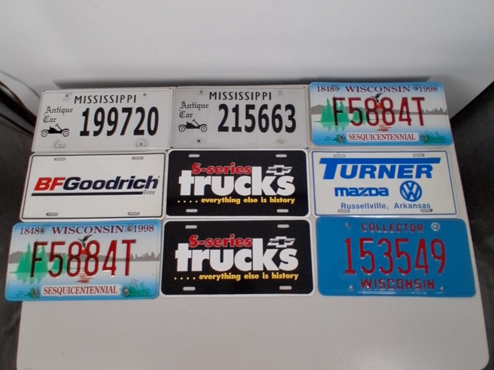 9 license plates incl. 5 state issued WI, Mississippi,