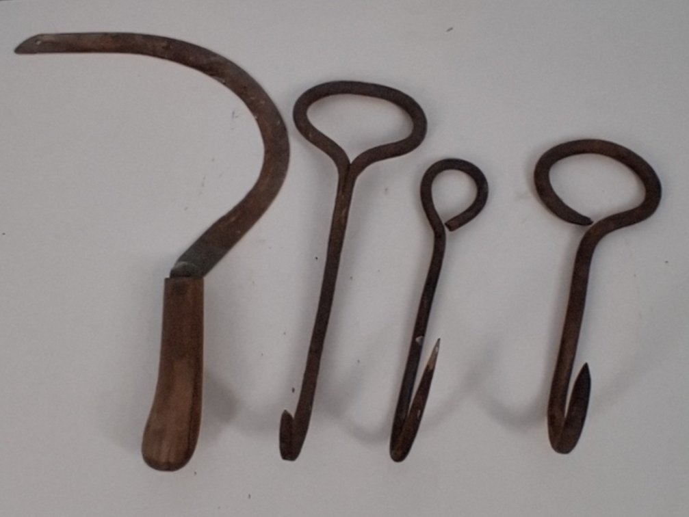 3 vintage hooks and a vintage hand scythe