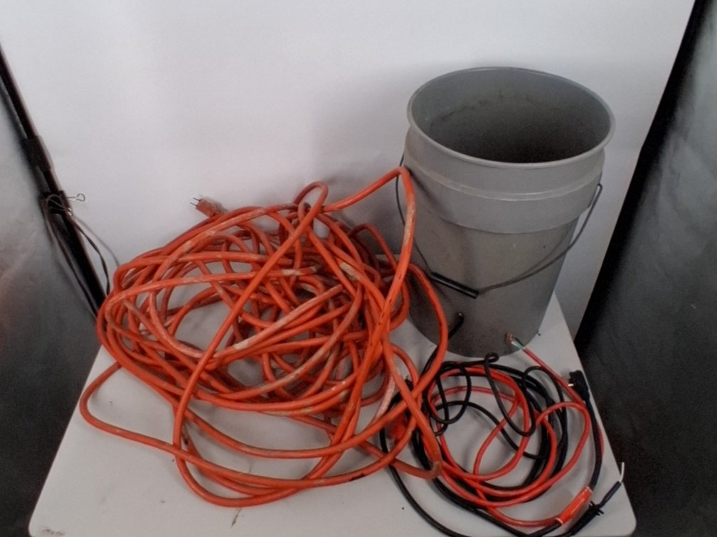 5 gallon bucket of a large extension cord and