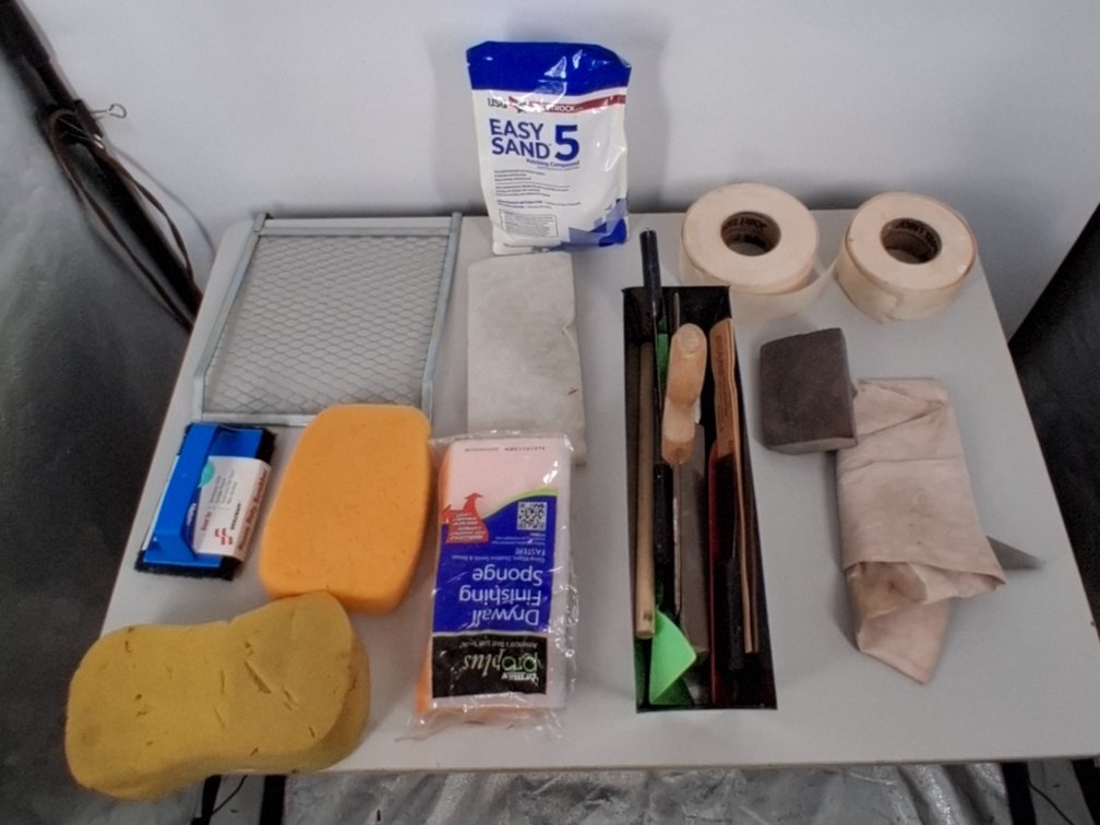 Drywall  lot of tape, sanding block, sand