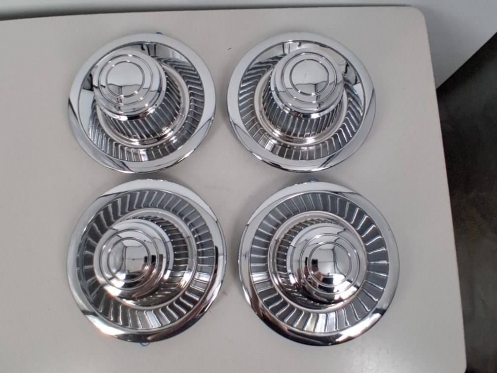 4 unmarked hubcaps, 9" diameter