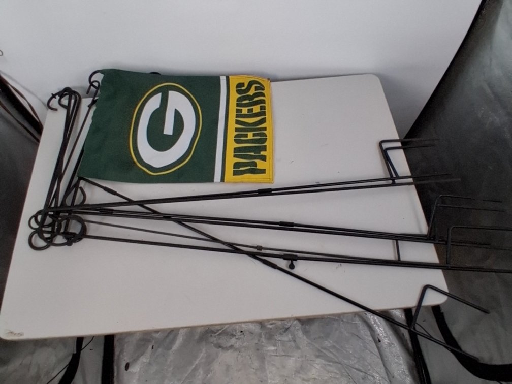 6 garden flag stakes and a GB Packers garden