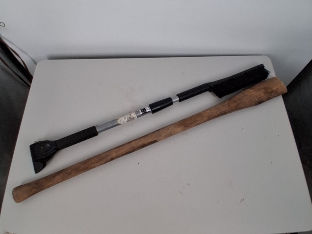 wooden axe handle and a windshield snow