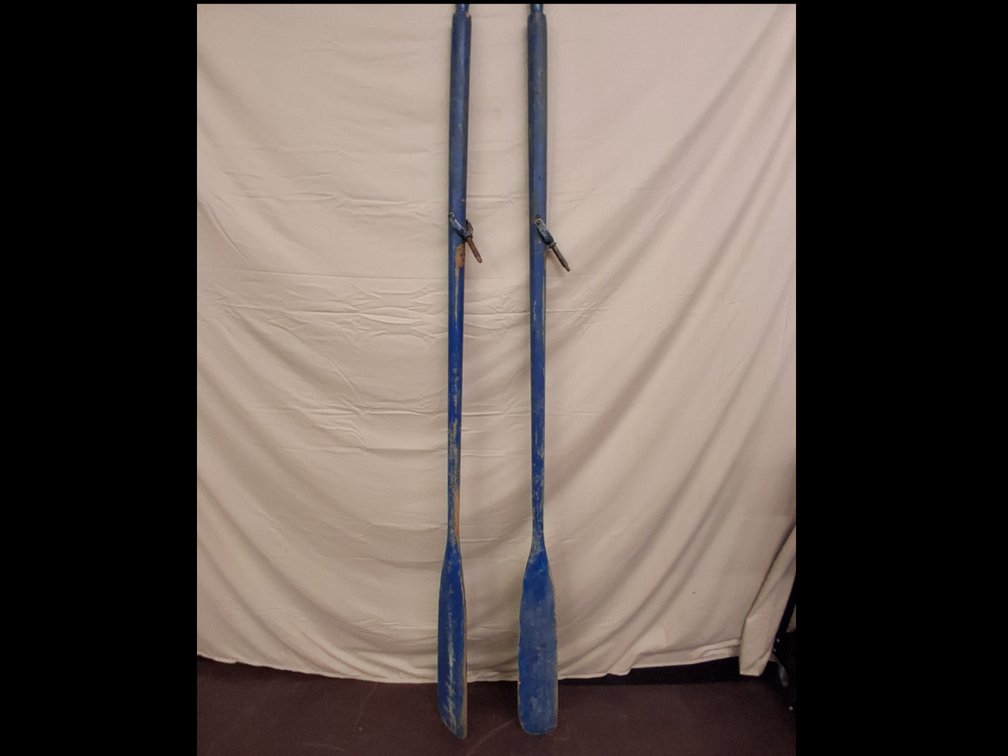 pair of vintage wooden oars painted blue