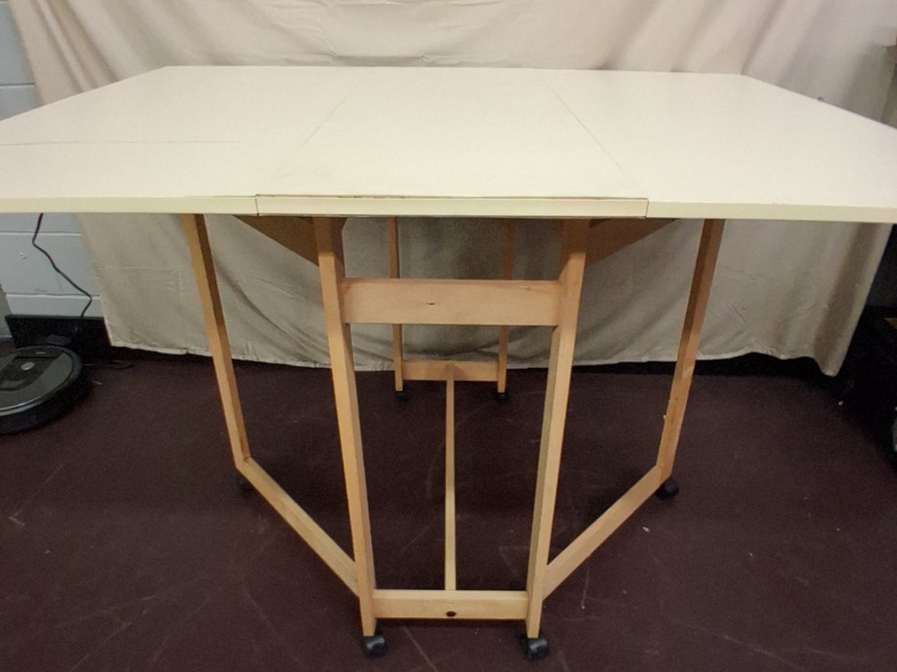 folding table, sides come out to support