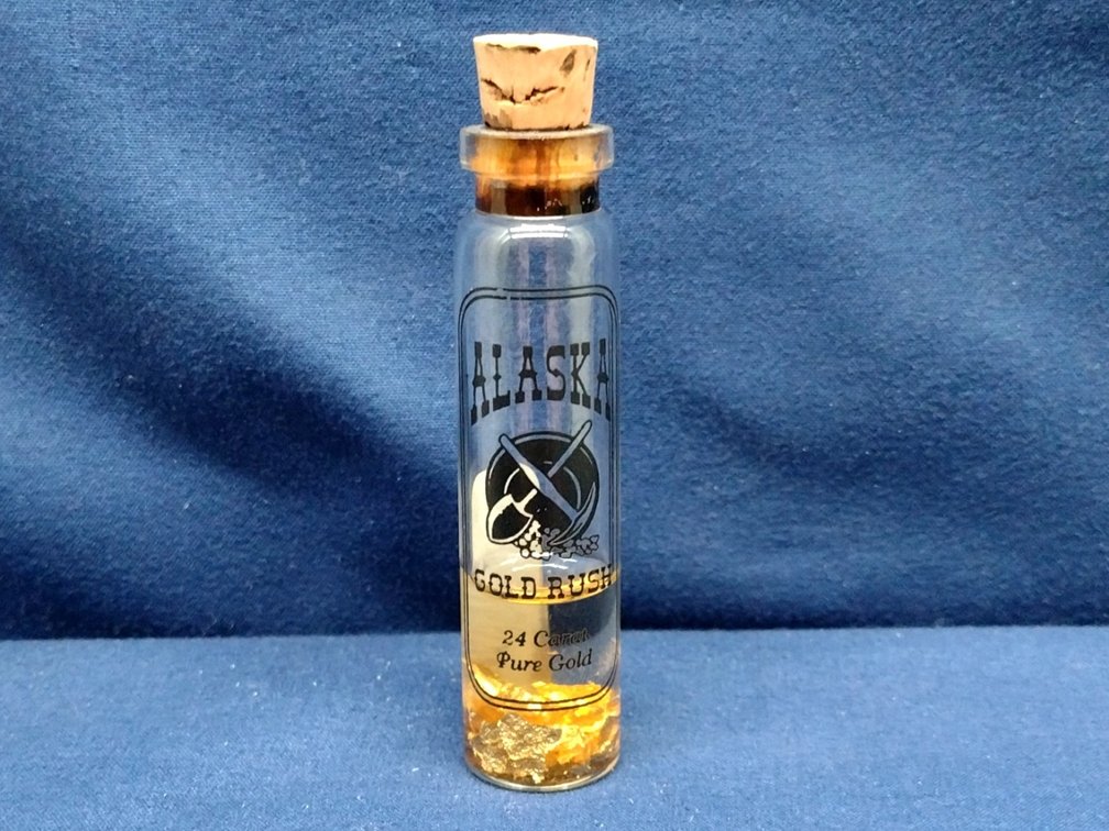 vile of gold flakes - Alaska Gold Rush