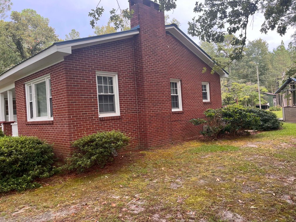 Image for 43 acres in Harnett County with a brick home in an onsite live /online / simulcast auction event!