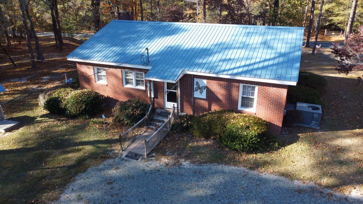 Image for 43 acres in Harnett County with a brick home in an onsite live /online / simulcast auction event!
