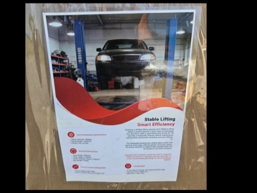 Blue 10,000lb hydraulic two-post automotive car lift