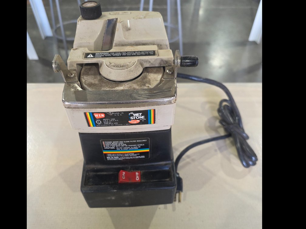 Wet stone sharpening machine