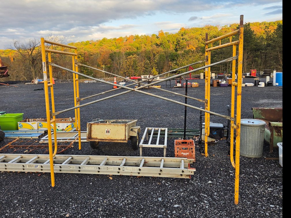 yellow steel-frame scaffolding