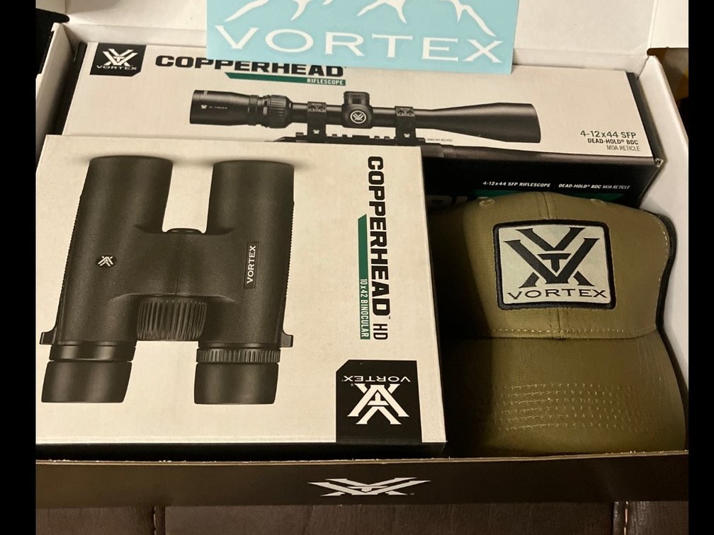 Brand new. Vortex 4-12-44mm scope. 10*42 binoculars and comes with a hat and decal