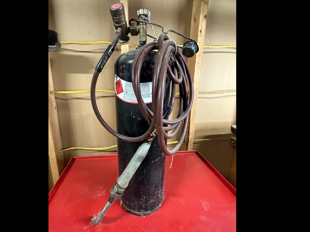 Small Torch set on tank of Acetylene, Dissolved