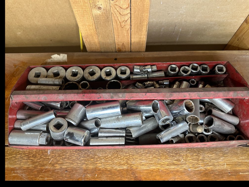 Red metal tool carrier with misc. sockets