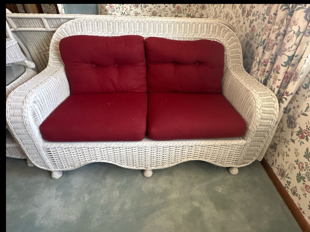 Wicker Love Seat with dark red cushion