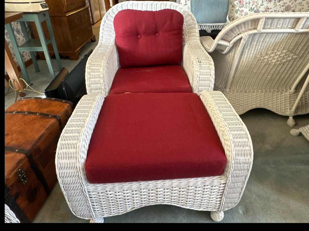 Wicker Chair and Ottoman.  Dark red cushions.