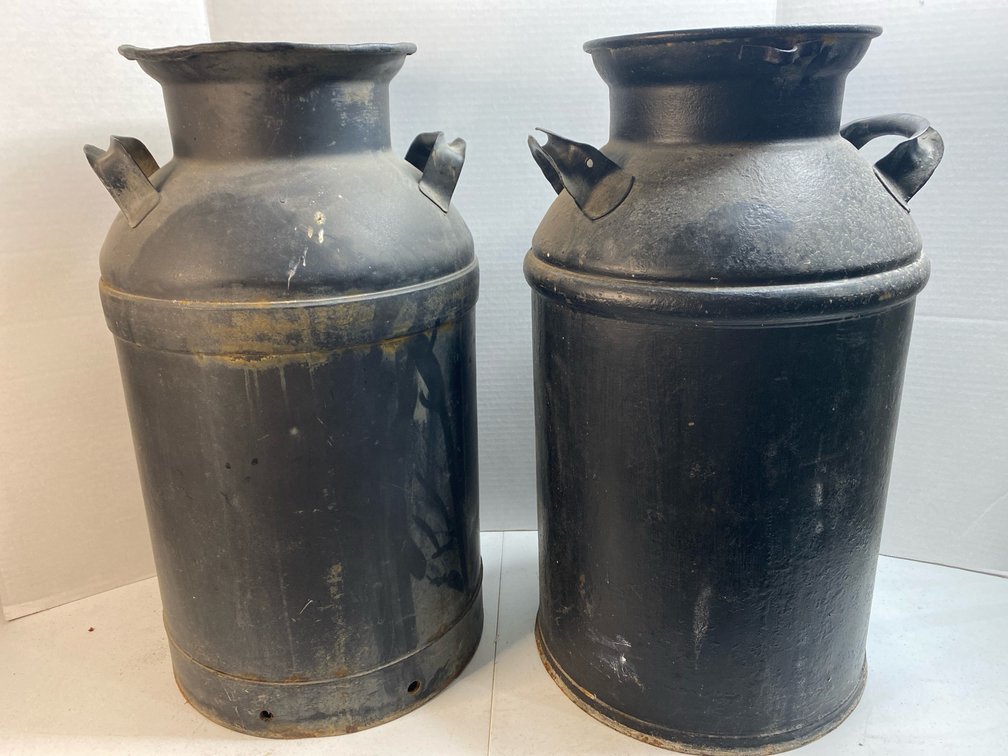 Pair of black Milk cans