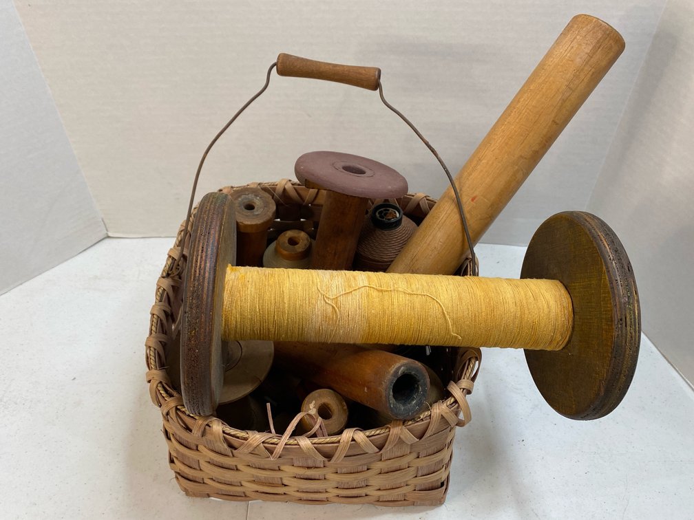 Basket Full of Wooden Spools 
