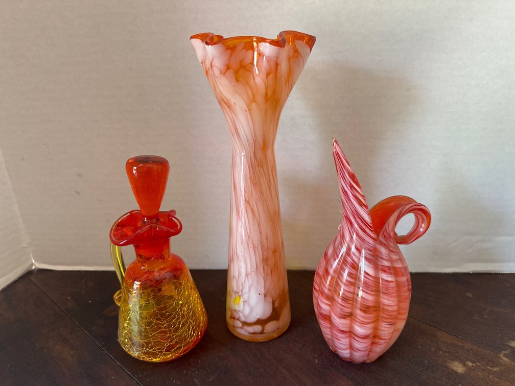 Three (3) red/orange glass vases