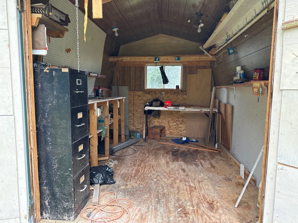 In backyard shed: 4 drawer filing cabinet, work table, and more