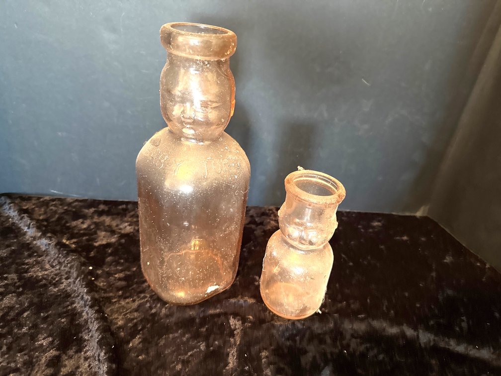Vintage pink glass brookfield baby face milk bottle