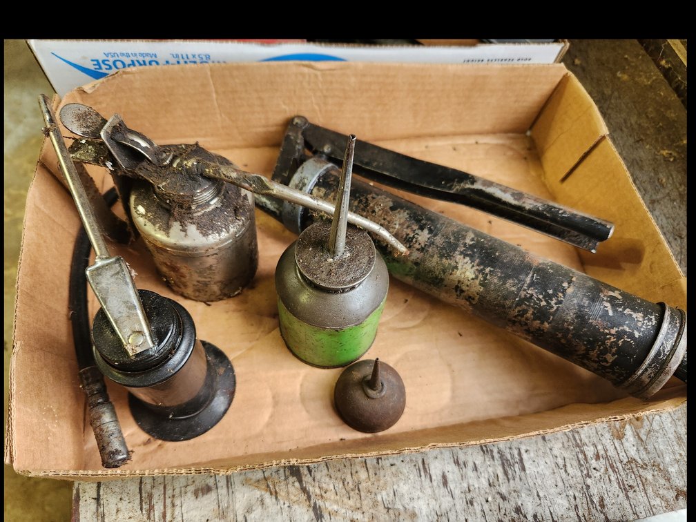 vintage oil cans and grease gun