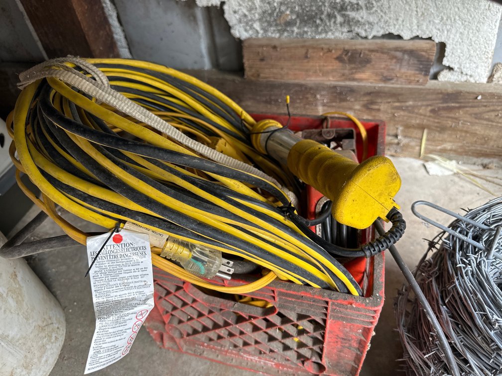 milk crate of extension cords