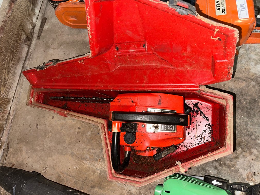 Homelite chainsaw in case with gas powered Hitachi leaf blower