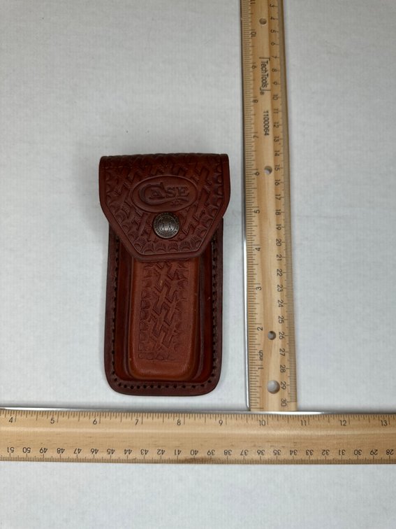 Case XX Changer Knife in leather belt snap case.   Knife handle is bone finish.