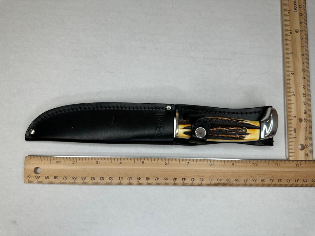 Case Buck Knife No 523-5SSP in black leather belt sheath.