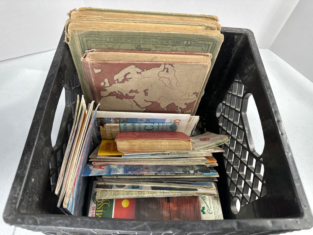 flat of vintage state maps and geography books 
