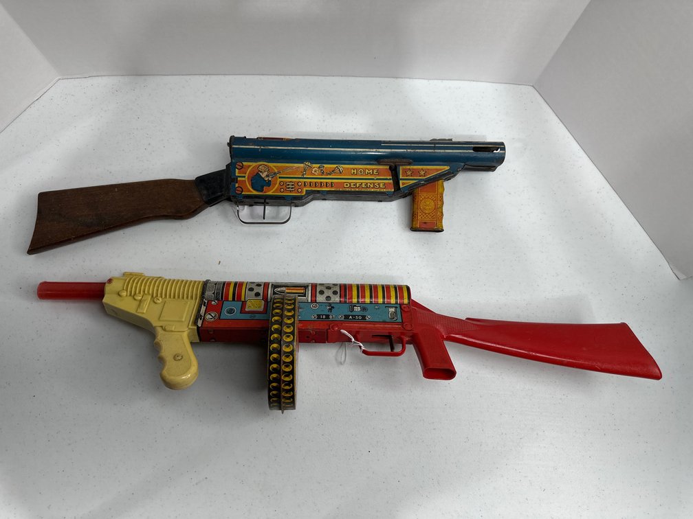 2 tin litho and plastic and wood toy wind up guns Marx