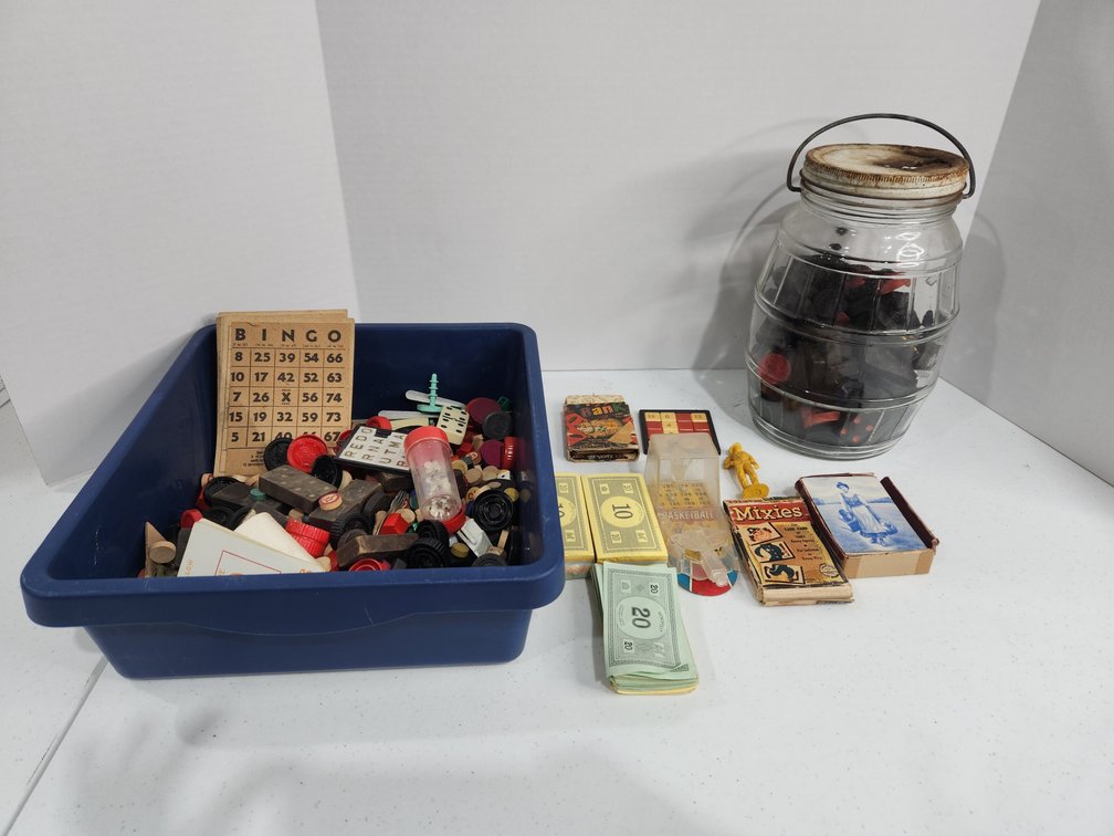 assorted board game parts, wooden blocks, dominoes