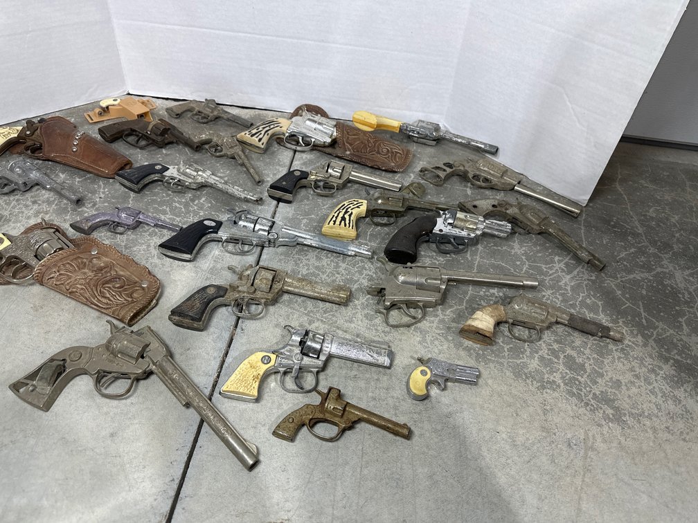 flats of cap guns and toy gun parts 