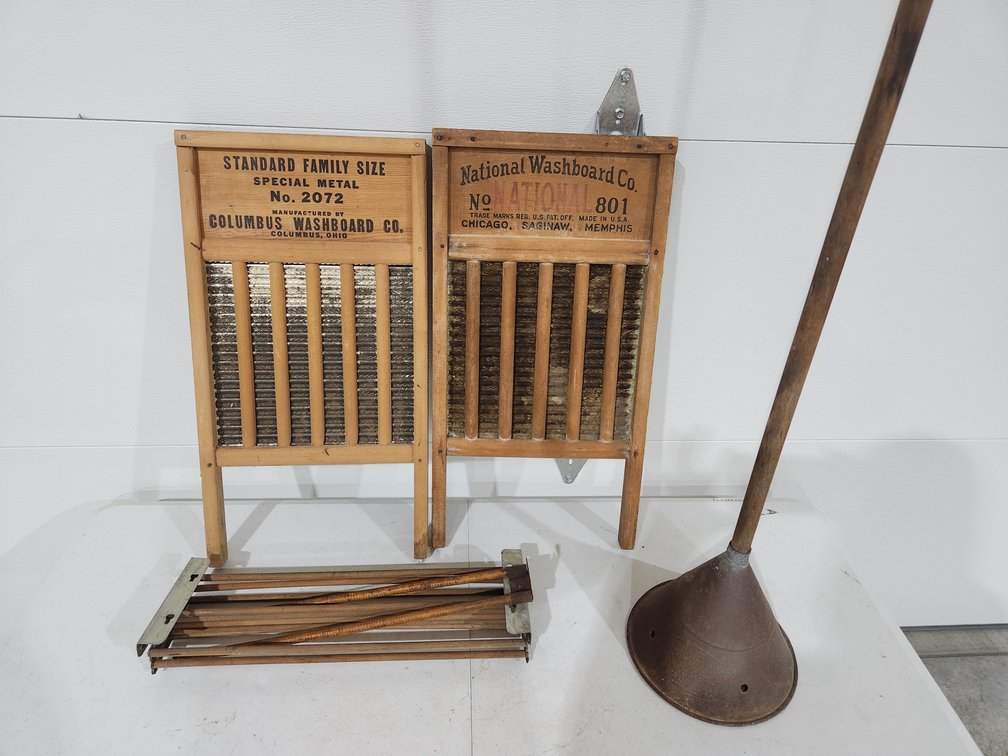lot of  wash board, primitive washing machine, and wooden clothesline 