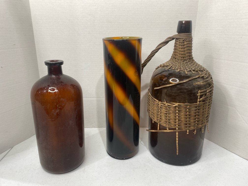 large brown glass jars and decorative vase