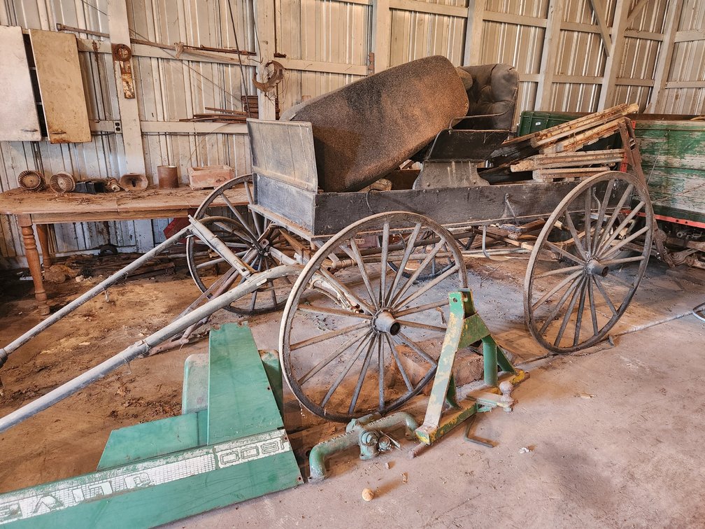 Black 4 Wheel Wagon - Horse drawn.  Wood wheels, platform bed.