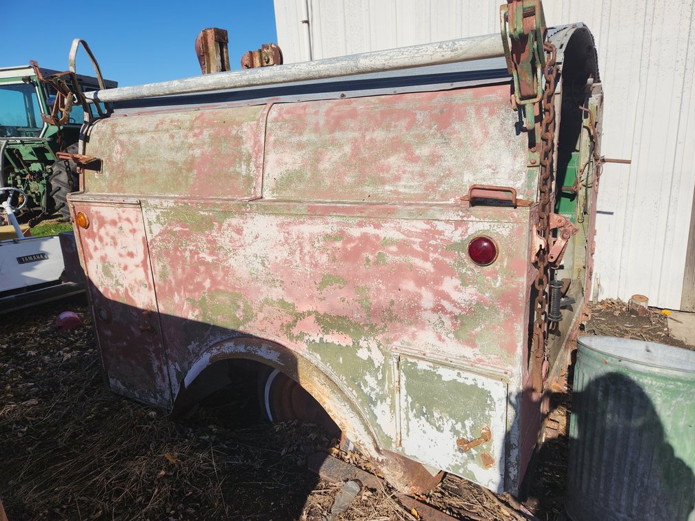 Covered utility bed trailer.  Includes scrap iron.