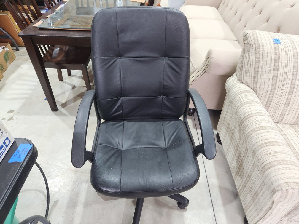 Black faux leather office chair with arms