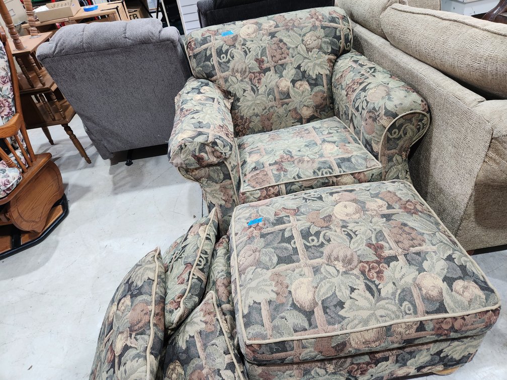 Two large lounge chairs, both with ottomans.