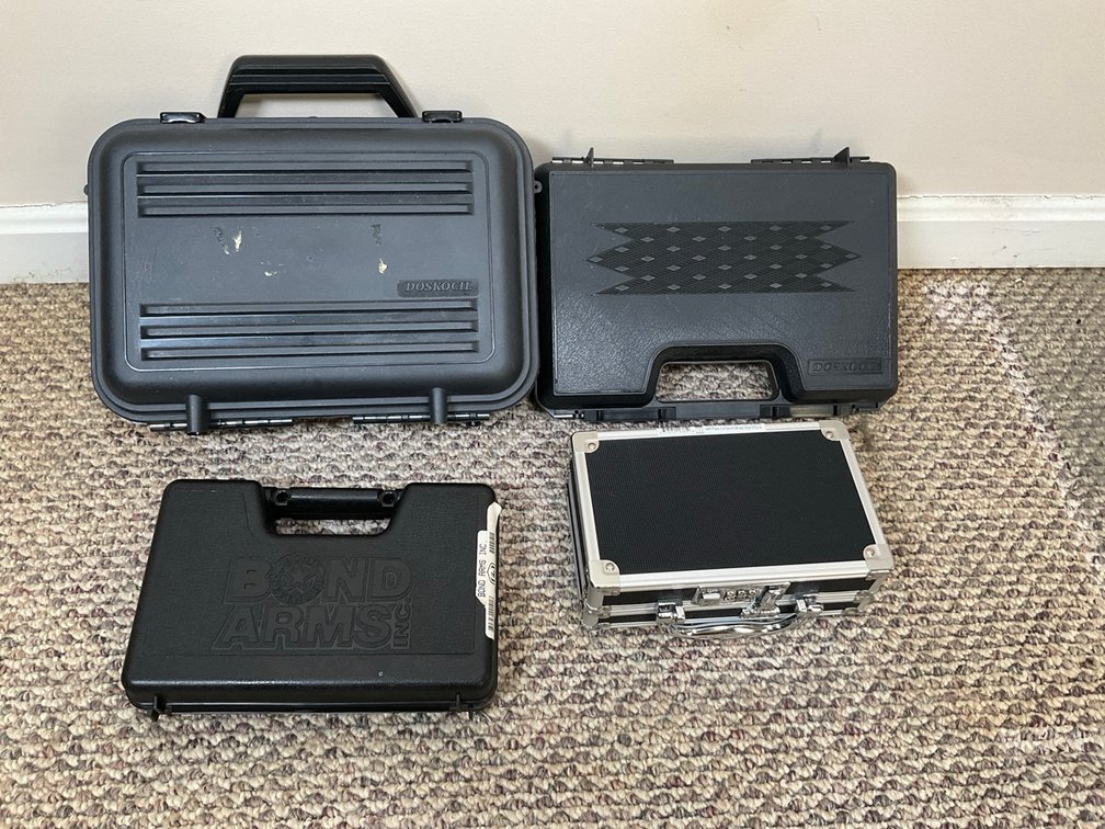 Assorted Hard Gun and Equipment Cases Including Doskocil and Bond Arms