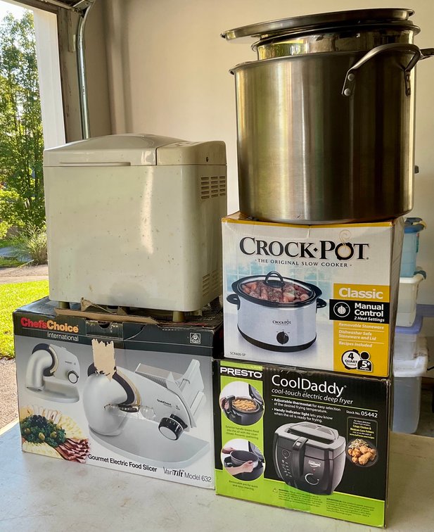 Assorted Kitchen Countertop Appliances and Stainless Steel Stockpots Collection