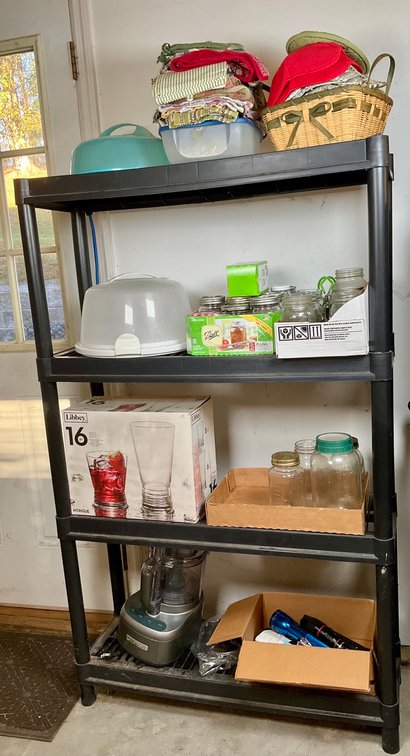 Plastic Storage Shelving with Kitchenwares and Canning Jars