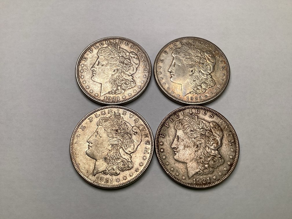 Four 1921 Morgan Silver Dollars