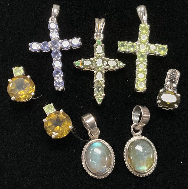 Eight Small Sterling Silver Pendants