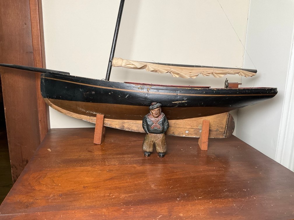 Hand Carved Wooden Sailor and Sailboat